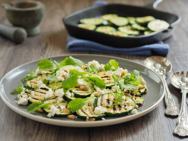 istock grilled courgette with pine nuts and feta cheese salad 831662152