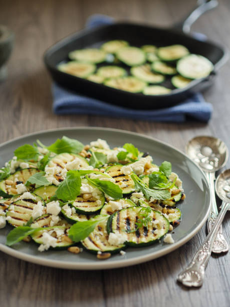 istock grilled courgette with pine nuts and feta cheese salad 831662162