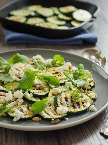 istock grilled courgette with pine nuts and feta cheese salad 831662164