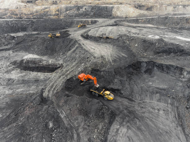 istock Aerial view open pit mine, loading of rock, mining coal, extractive industry 831664740