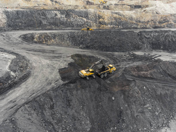 istock Aerial view open pit mine, loading of rock, mining coal, extractive industry 831664952