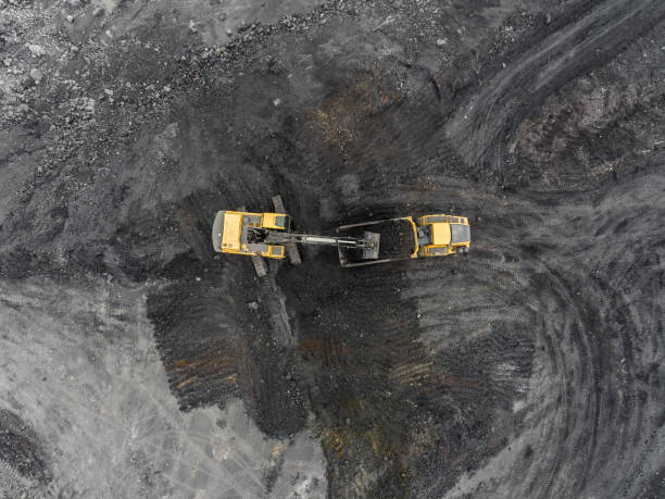 istock Aerial view open pit mine, loading of rock, mining coal, extractive industry 831665074