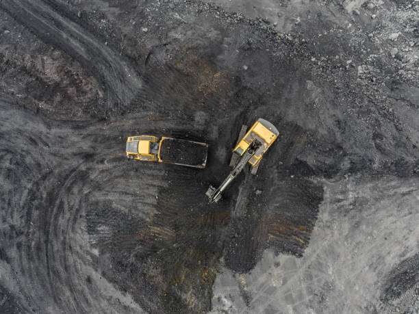 istock Aerial view open pit mine, loading of rock, mining coal, extractive industry 831665114