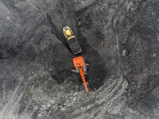 istock Aerial view open pit mine, loading of rock, mining coal, extractive industry 831665190