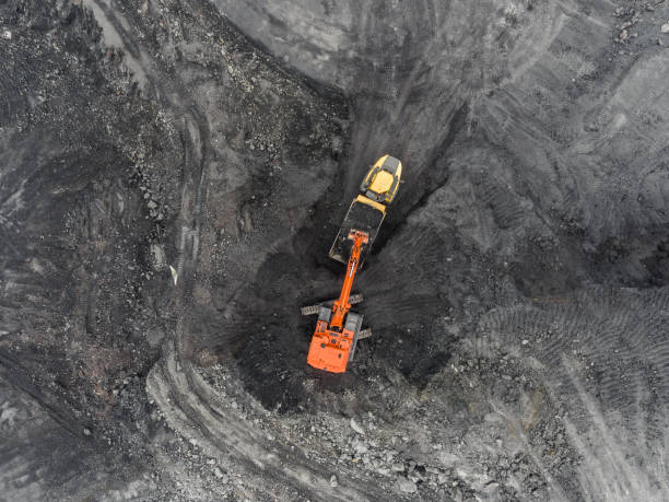 istock Aerial view open pit mine, loading of rock, mining coal, extractive industry 831665256