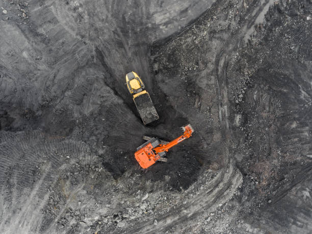 istock Aerial view open pit mine, loading of rock, mining coal, extractive industry 831665328