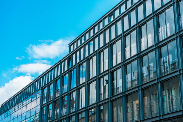 istock office glass buildings in a row 831668580