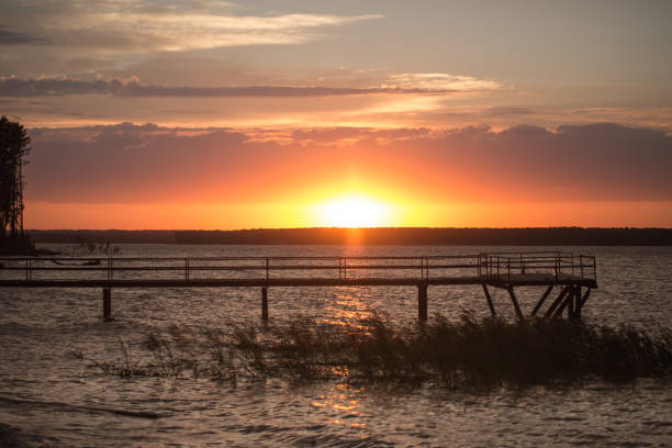 istock Wooden pier at sunset 831672260