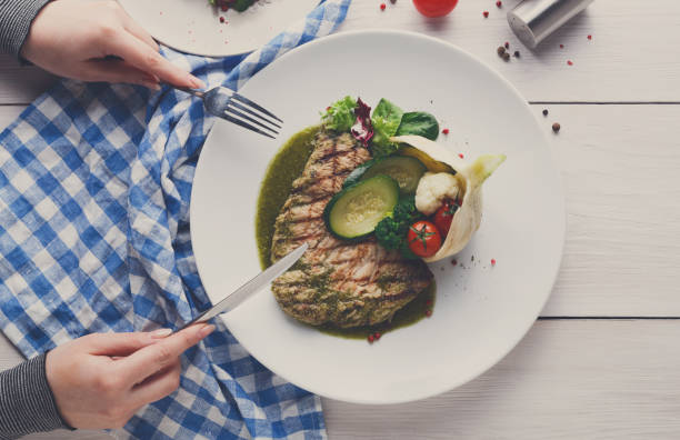 istock Grilled beefsteak with vegetables and green bell pepper sauce 831672374