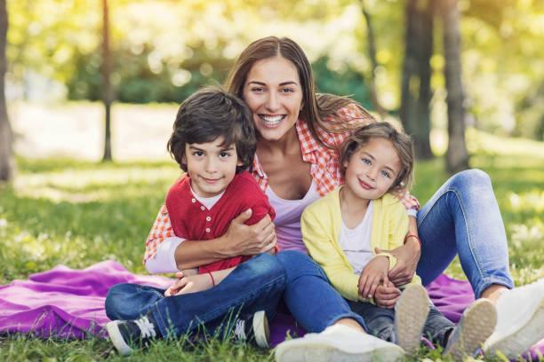 istock Beautiful mother with two children 831679748