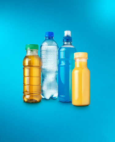 Shot of a group of healthy soft drinks on a vibrant blue background with copy space