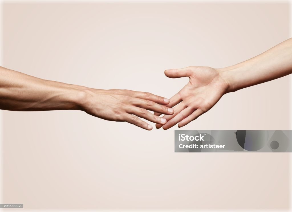 Touching. Hands of man and woman reaching to each other Hand Stock Photo