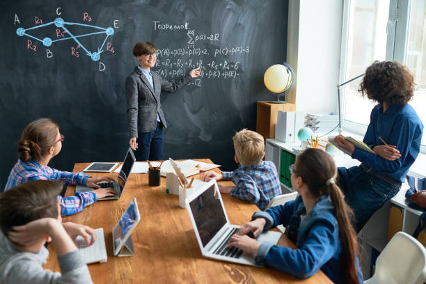 istock Modern students at lesson of Geometry 831685060