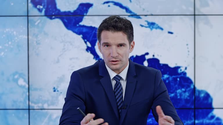 LD Caucasian male anchor presenting the news