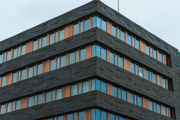 istock modern finance building with black and orange facade 831700354