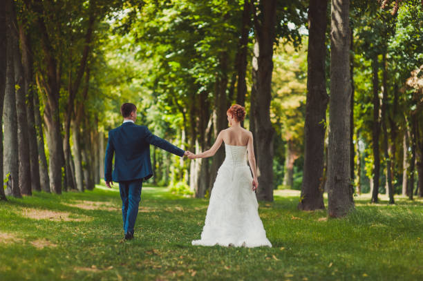 istock Beautiful bride and groom couple walking at the wedding 831700618
