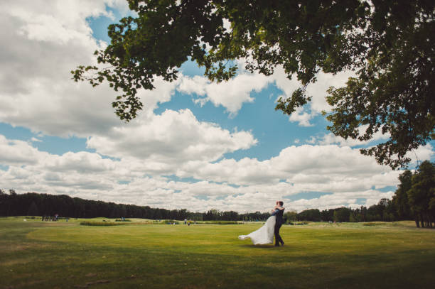 istock Beautiful bride and groom couple walking at the wedding 831700666