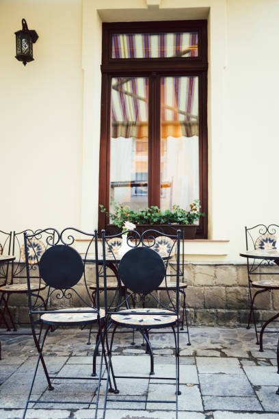 istock Empty chairs in outdoor cafe or restaurant 831702742