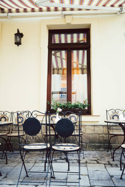 istock Empty chairs in outdoor cafe or restaurant 831703602