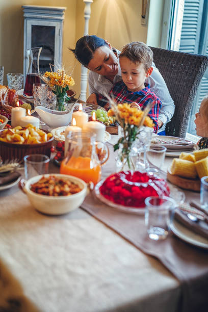 istock Family Having Traditional Holiday Stuffed Turkey Dinner 831703888