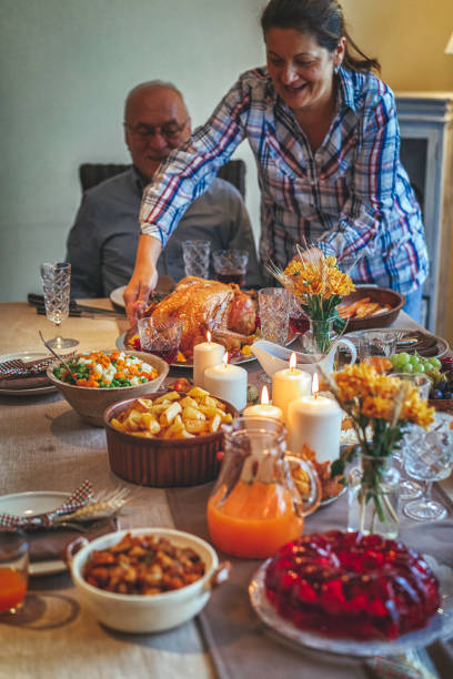 istock Family Having Traditional Holiday Stuffed Turkey Dinner 831703920