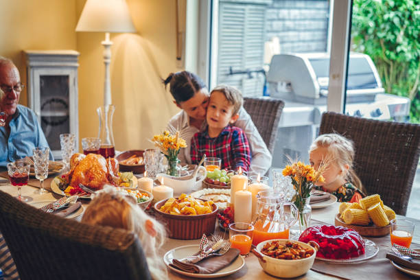 istock Family Having Traditional Holiday Stuffed Turkey Dinner 831703942