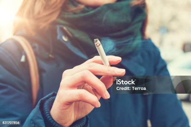 Young Woman Enjoying A Cigarette Stock Photo - Download Image Now - Smoking Issues, Smoking - Activity, Cigarette