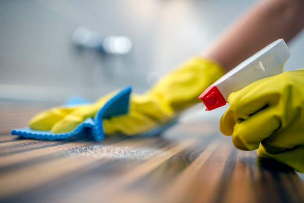 istock Man cleaning home with protective gloves 831711872