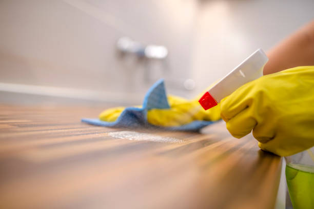 istock Hand with glove using cleaning sponge to clean up 831711876