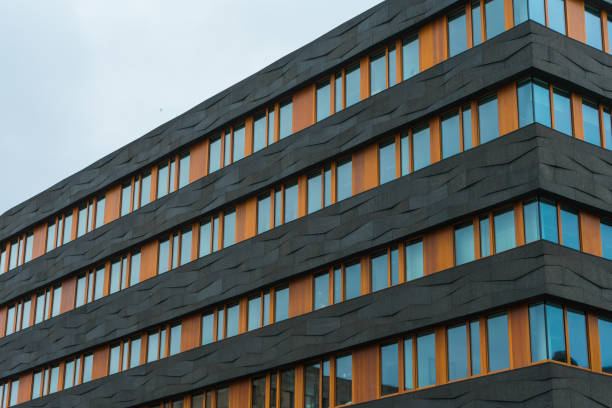istock black and orange finance or office building 831712020