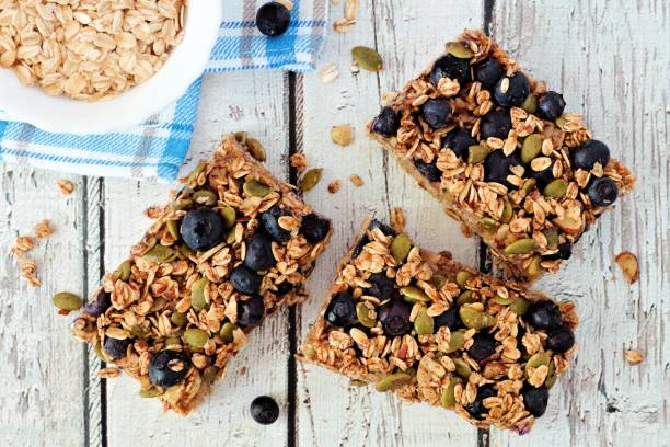istock Superfood breakfast bars, overhead on white wood 831716434