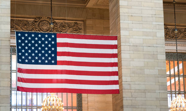 istock Large US Flag in Grand Central Station 831717128