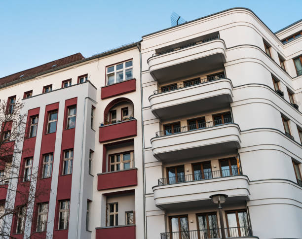 istock white apartment house with red balconies 831720738