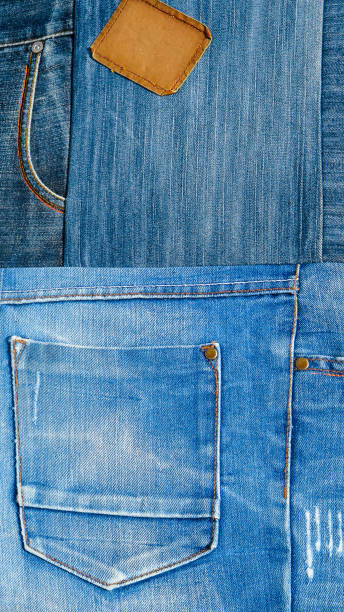 istock Background texture of denim fabric with pockets and stitched seams with buttons and rivets from different pieces of jeans. 831724404
