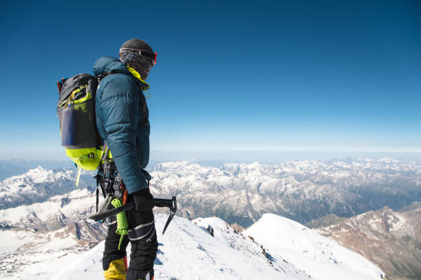 istock Professional guide - climber on the snow-covered summit of Elbrus sleeping volcano 831727594