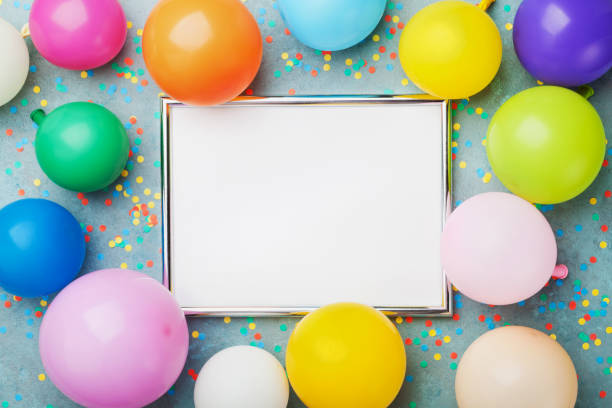 istock Colorful balloons, silver frame and confetti. Birthday or party mockup for planning. Flat lay style. Copy space for text. Festive greeting card. 831732134
