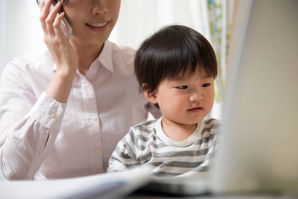 istock young mother working in house with her child 831733556