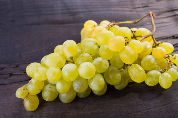 istock Freshly cut grapes is sweet fruit on the wood 831735846
