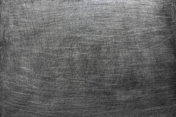 istock dark metal background, gray texture steel stains from the brush 831739280