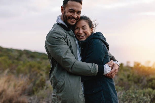 istock Romantic couple hugging in the countryside 831740178
