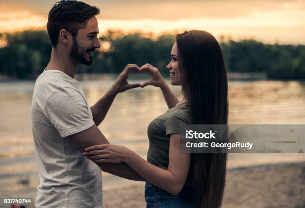 Romantic Young Couple Stock Photo - Download Image Now - Adult, Beach, Beautiful People