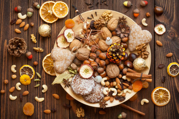 Snacks and decorations for Christmas on a bamboo plate.
