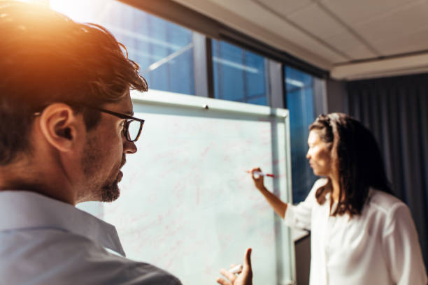 istock Business colleagues discussing ideas in office. 831741432