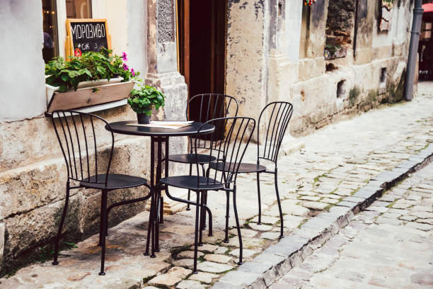 istock Empty chairs in outdoor cafe or restaurant 831745624