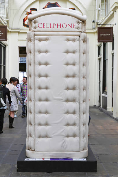 Padded Cell Phone Box LONDON, UNITED KINGDOM - JUNE 23: Telephone booth in London on JUNE 23, 2012. Padded Cell Phone Box from Bert Gilbert at Covent Garden in London,  United Kingdom. british telecom photos stock pictures, royalty-free photos & images
