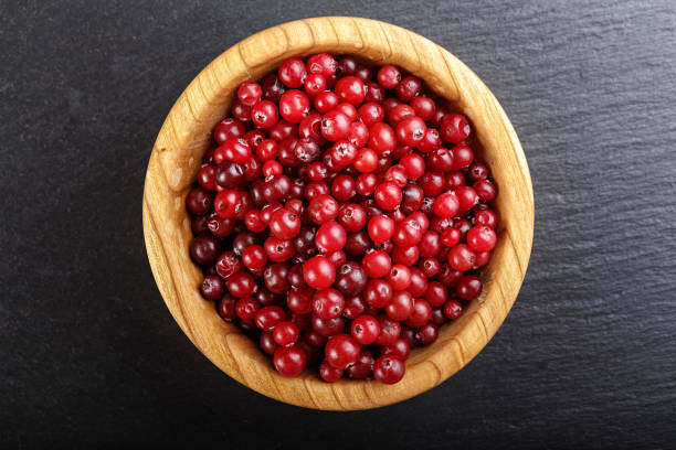 istock wooden plate with cranberry 831751894