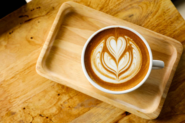 istock Coffee cup in coffee shop on wooden table. 831752610