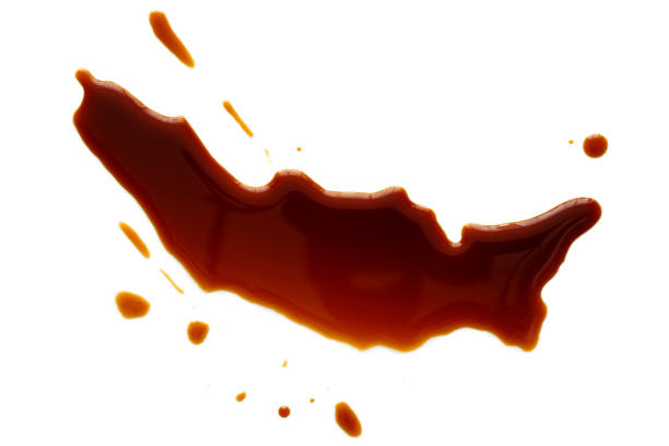 istock Spilled soya sauce isolated on white from above. 831752978