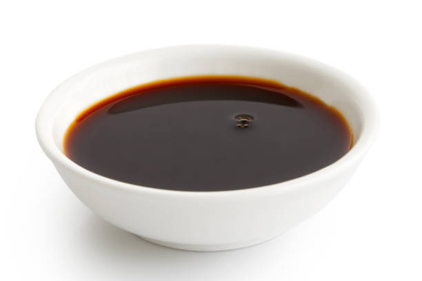 istock Soya sauce in white ceramic bowl isolated on white. 831756374