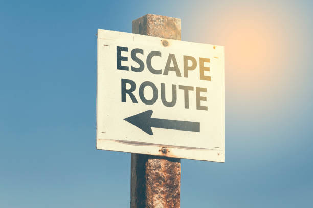 istock Escape route word and arrow signpost 3 831763020